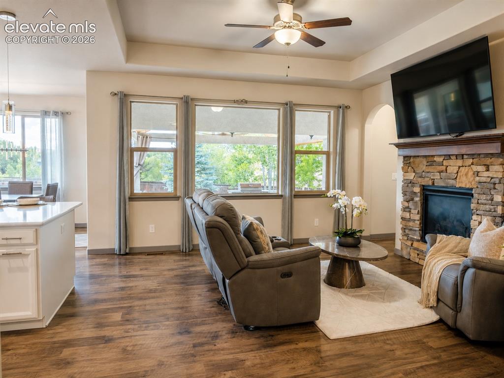 Image 8 of 31: Living Room with gas fireplace and views to the patio and backyard