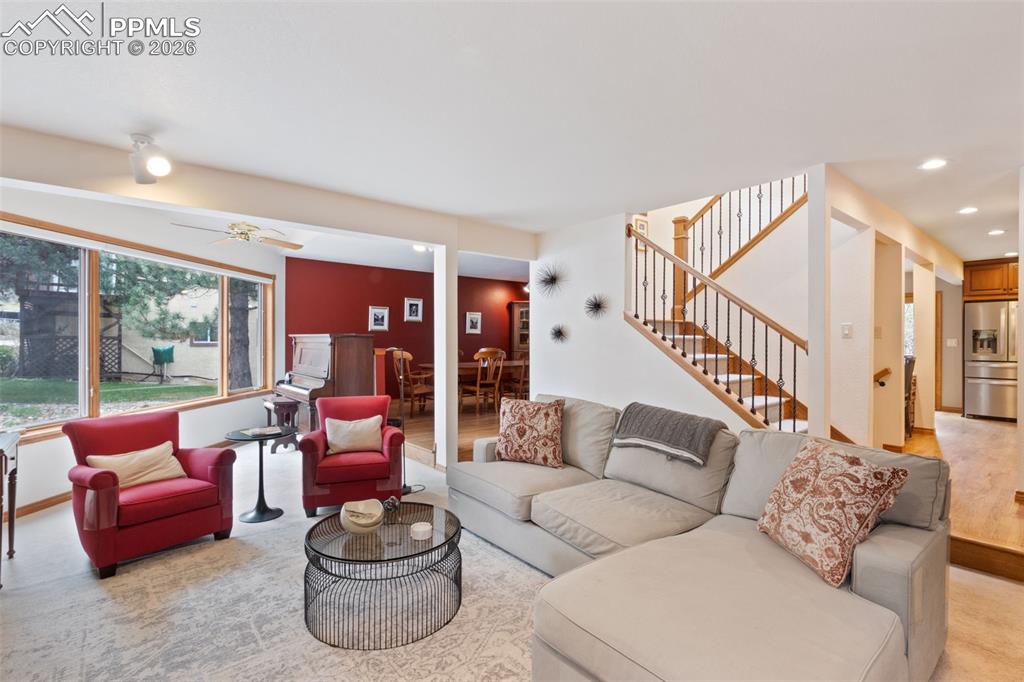 Image 15 of 47: Living room featuring large windows for a lot of natural lighting