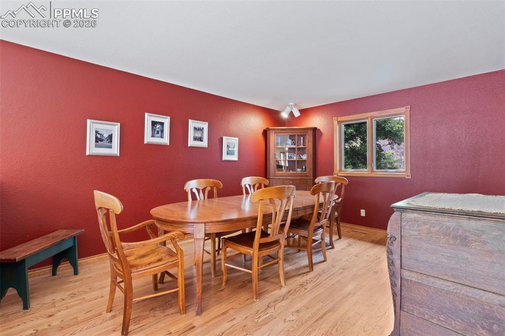 Image 17 of 47: Formal dining room featuring hardwood flooring
