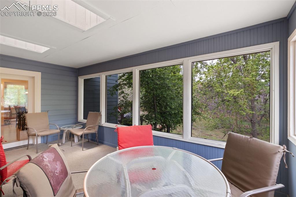 Image 25 of 47: Sunroom with skylights