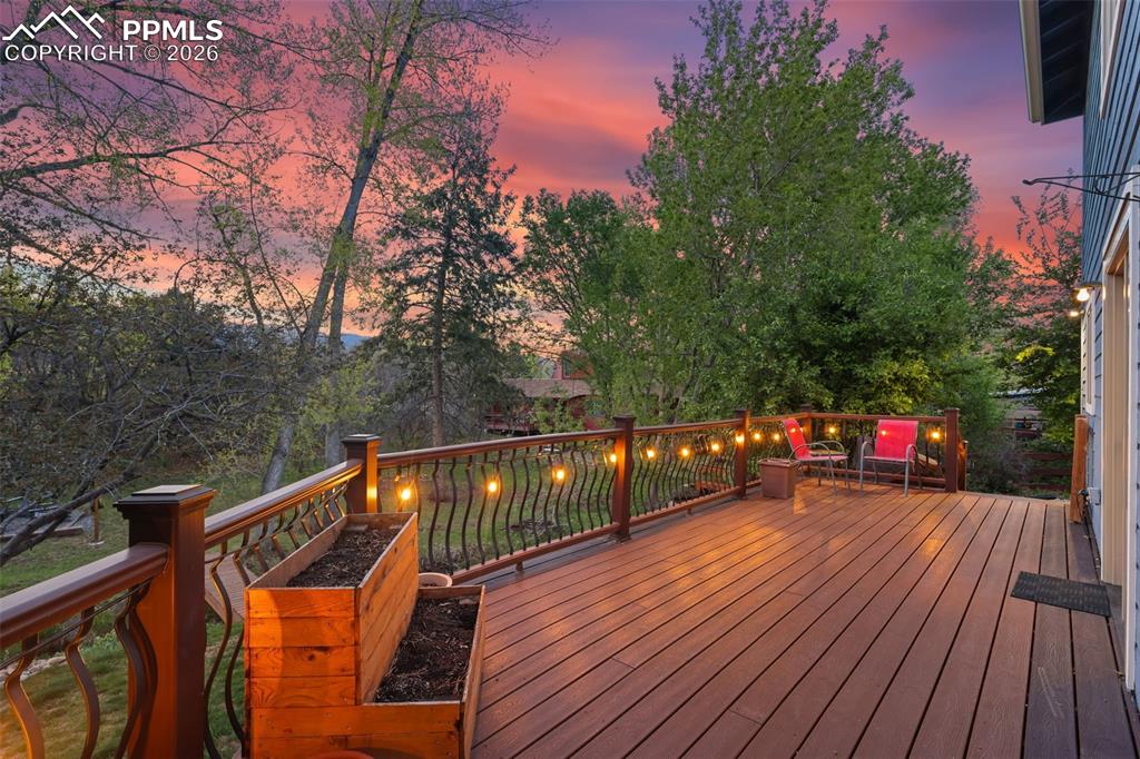 Image 4 of 47: Outdoor deck featuring trex decking and decorative metal railings