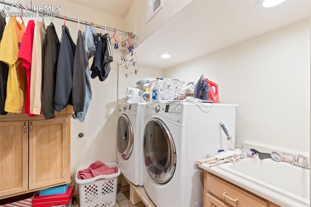 Image 41 of 47: Dedicated laundry area in basement