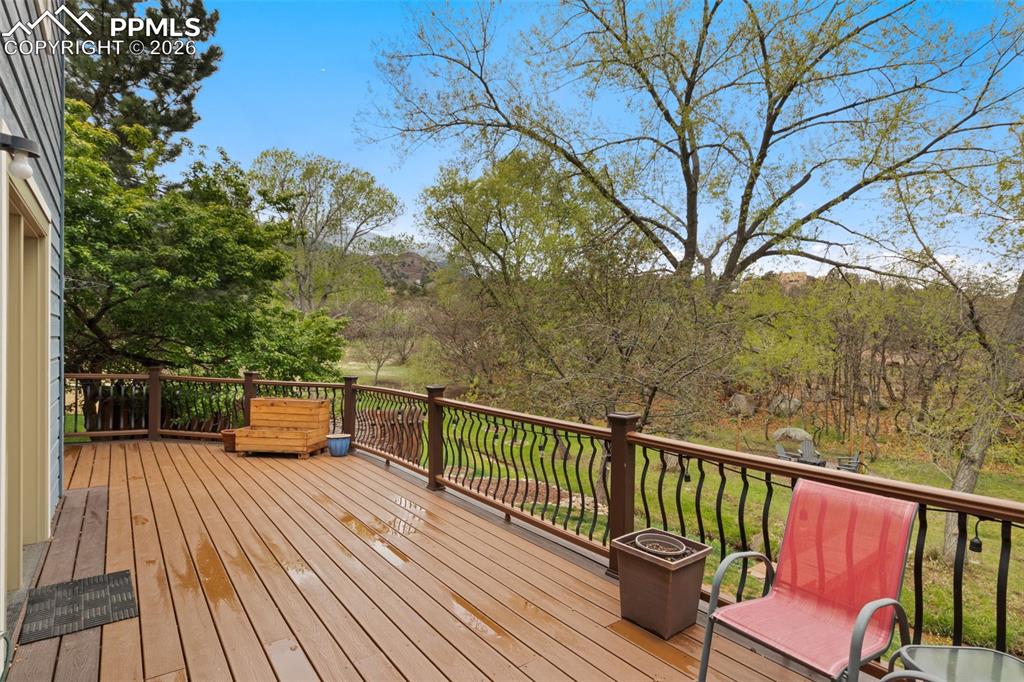 Image 42 of 47: Spacious outdoor deck overlooking backyard