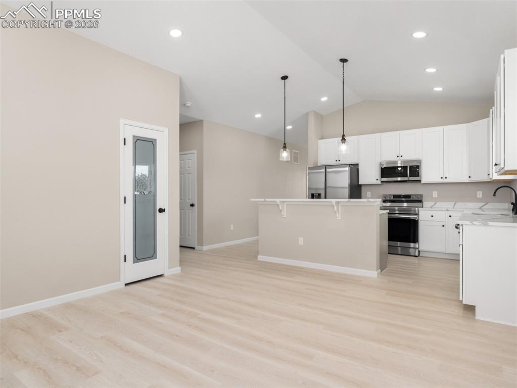 Image 10 of 26: Additional view of kitchen from Dining area.