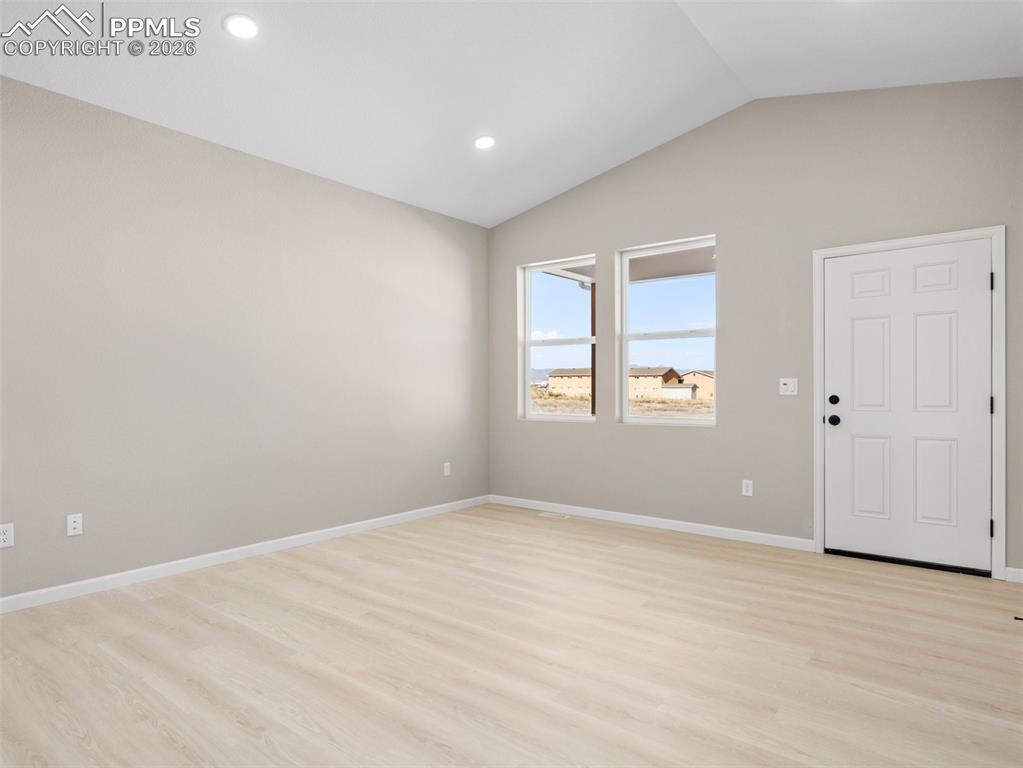 Image 12 of 26: Dining area with access to the back of home.