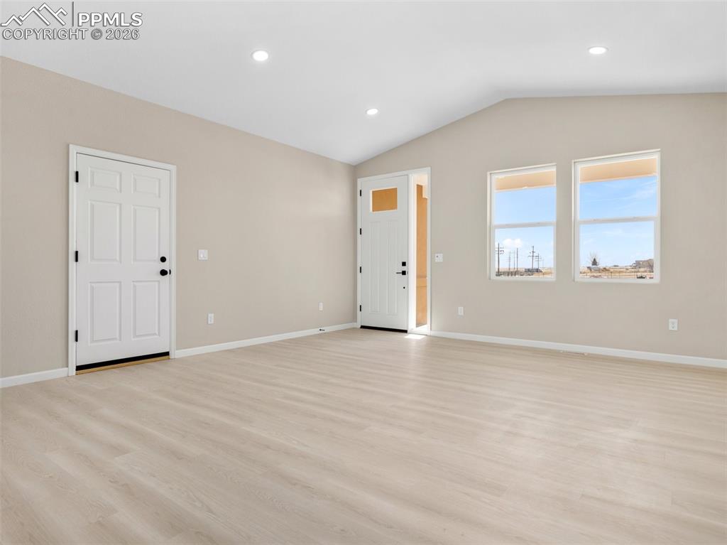 Image 5 of 26: View of the front entrance from the living room.