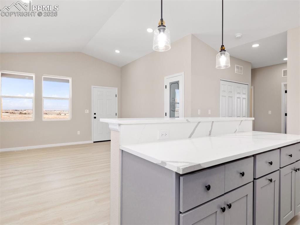 Image 9 of 26: Space behind bar seating could be a Dining area or another family room!