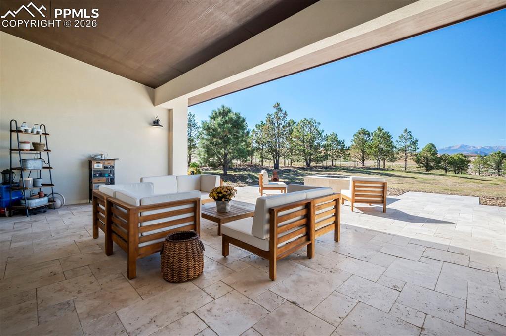 Image 16 of 33: Open Window Wall from Great Room to patio