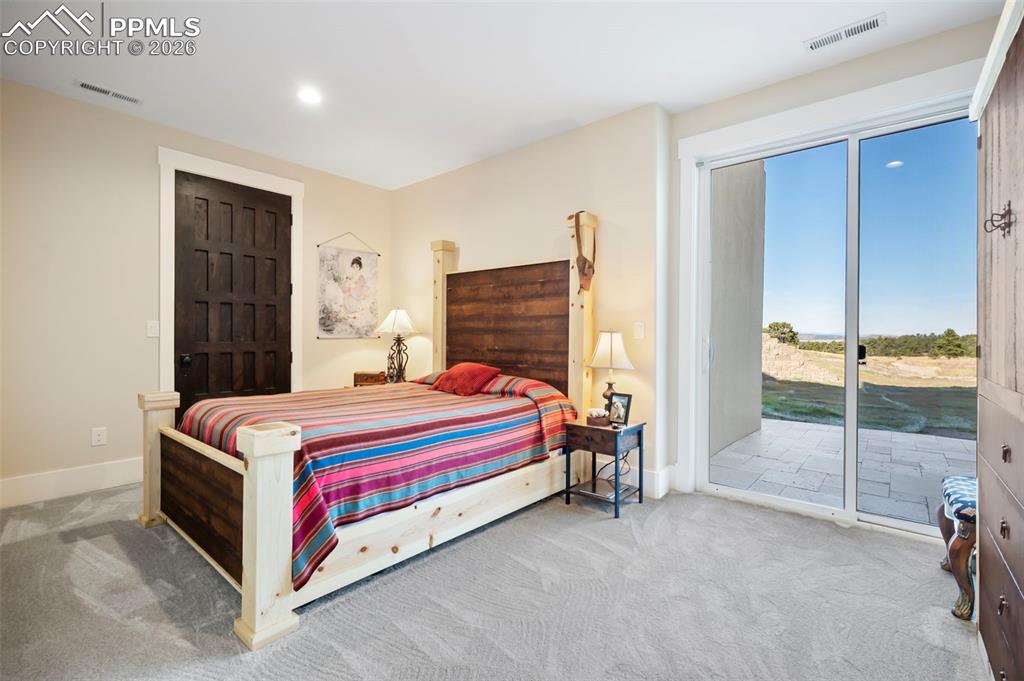 Image 27 of 33: Lower-Level Bedroom