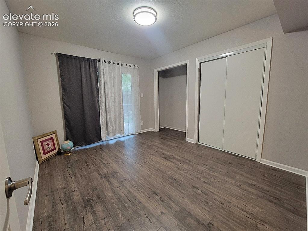 Image 21 of 25: 3rd bedroom has a Walk-Out to Backyard!