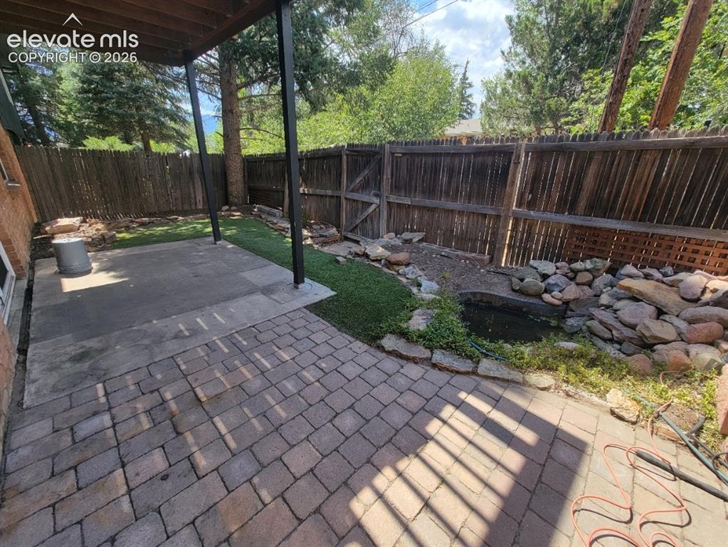 Image 23 of 25: Private Backyard! Even has a pond!