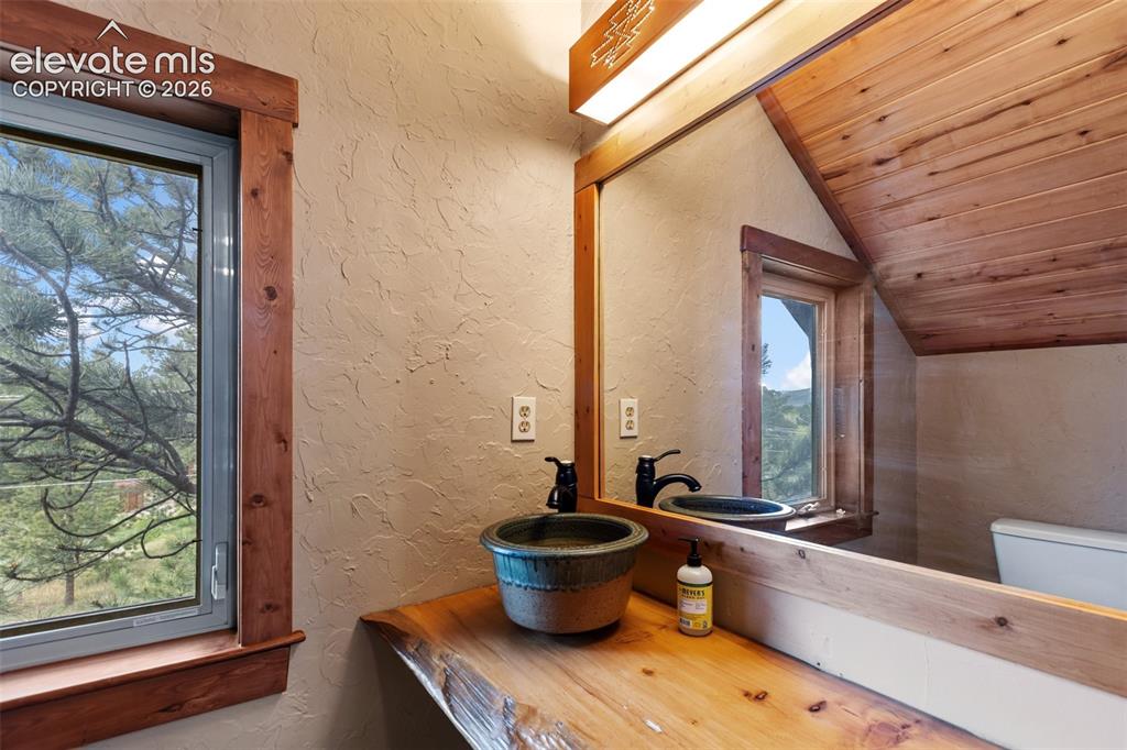 Image 13 of 37: 1/2 bathroom in loft.