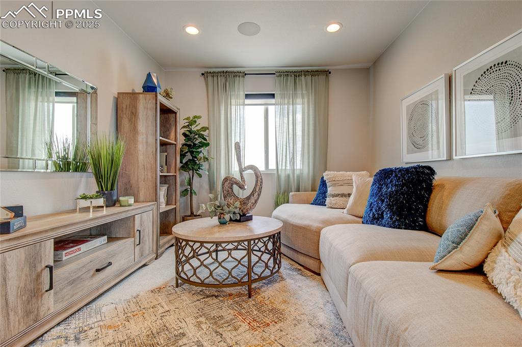 Image 12 of 25: Living area featuring healthy amount of natural light and recessed lighting