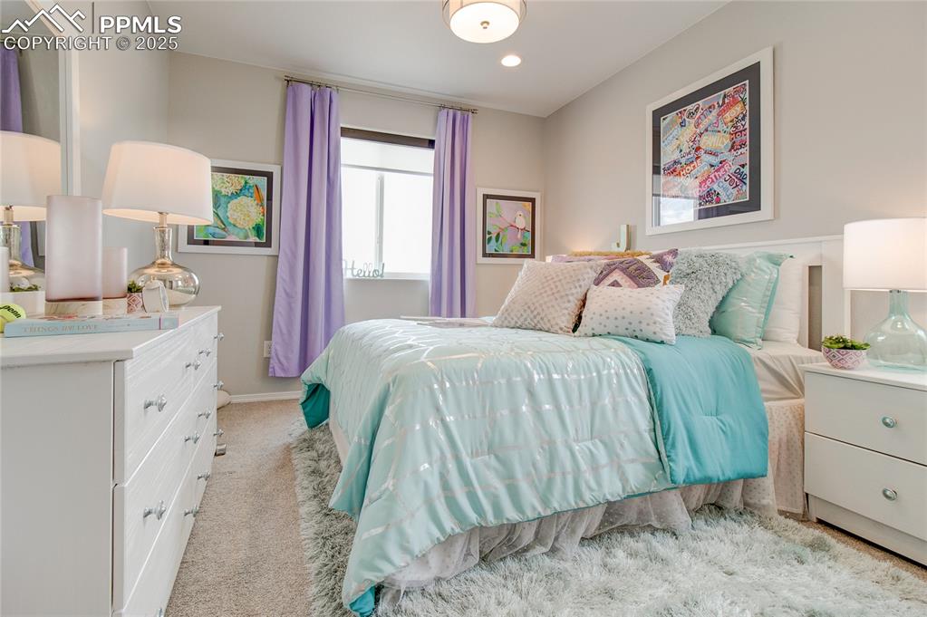Image 19 of 25: Bedroom with carpet and recessed lighting
