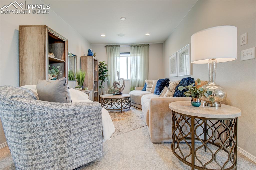 Image 20 of 25: Living room featuring recessed lighting and baseboards