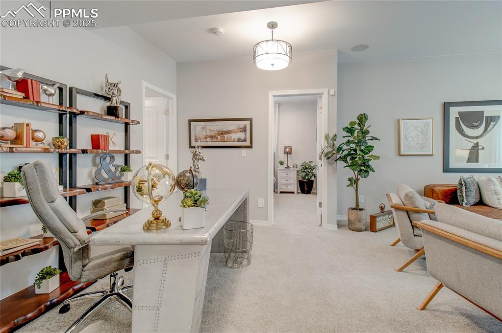 Image 21 of 25: Office space featuring light colored carpet and baseboards