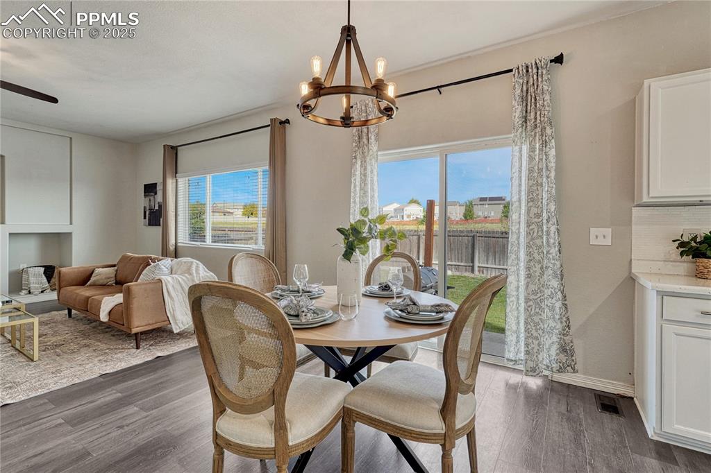 Image 12 of 50: Dining area provides a walk-out to the backyard