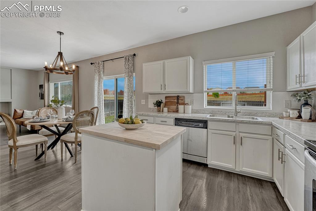Image 13 of 50: Island kitchen with new butcher block counter and formica countertops