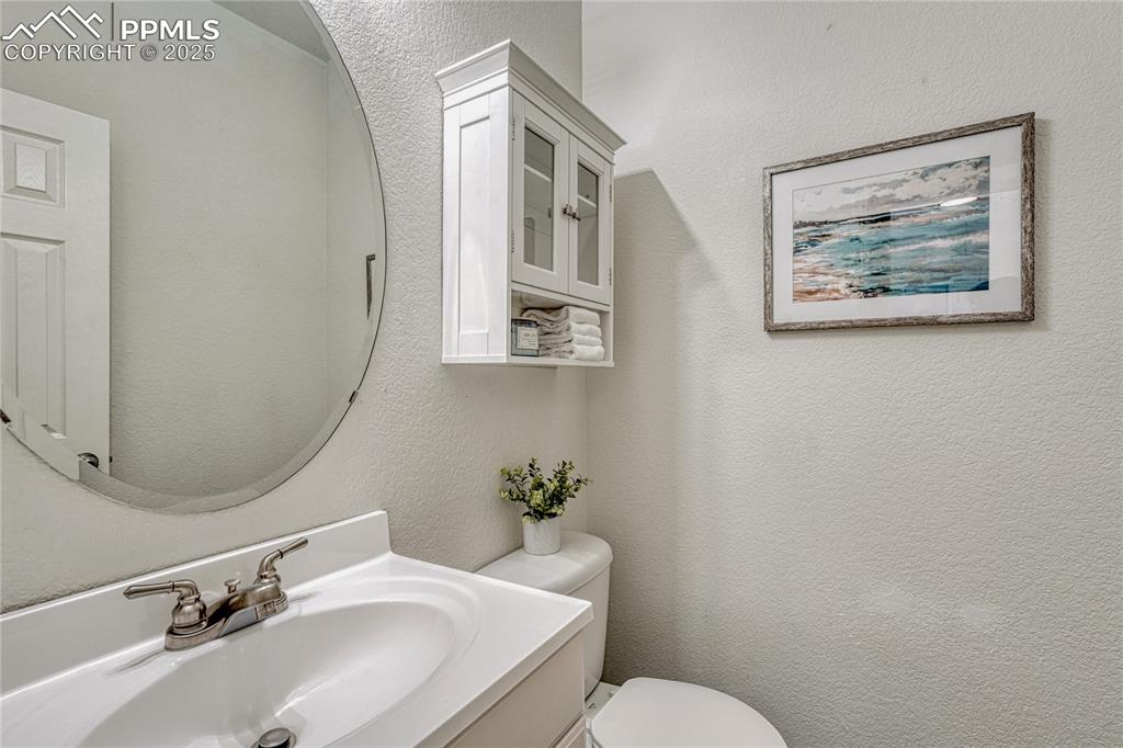 Image 22 of 50: Main level half bath