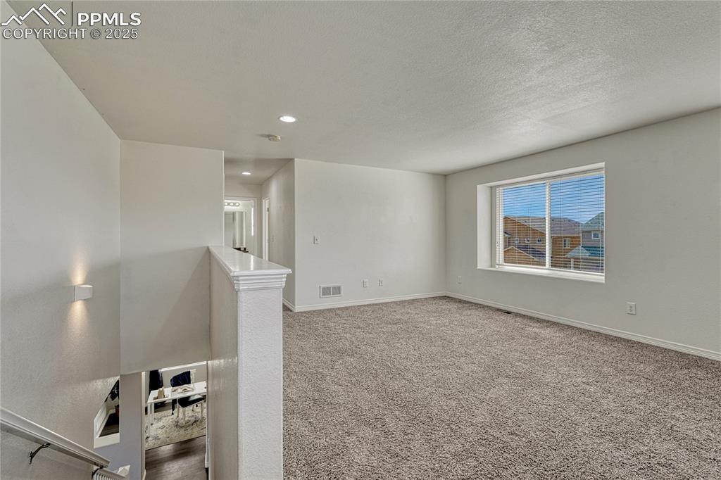 Image 23 of 50: Upper level loft area