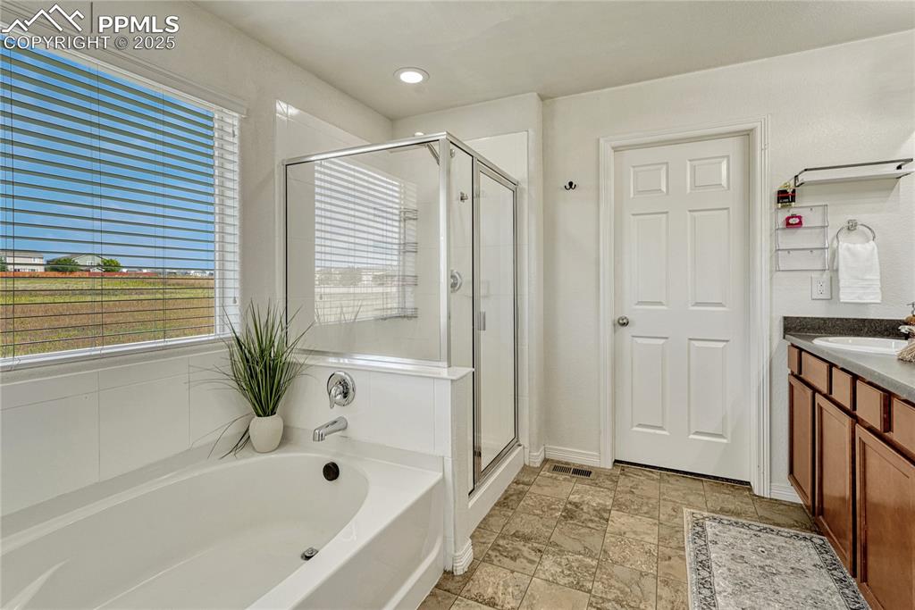 Image 8 of 50: 5-Piece Primary Bathroom with soaking tub, standalone shower, double sink v