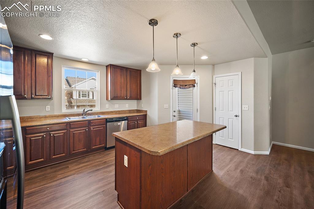 Image 15 of 50: Large kitchen with pantry and tons of counter space and breakfast bar. 
