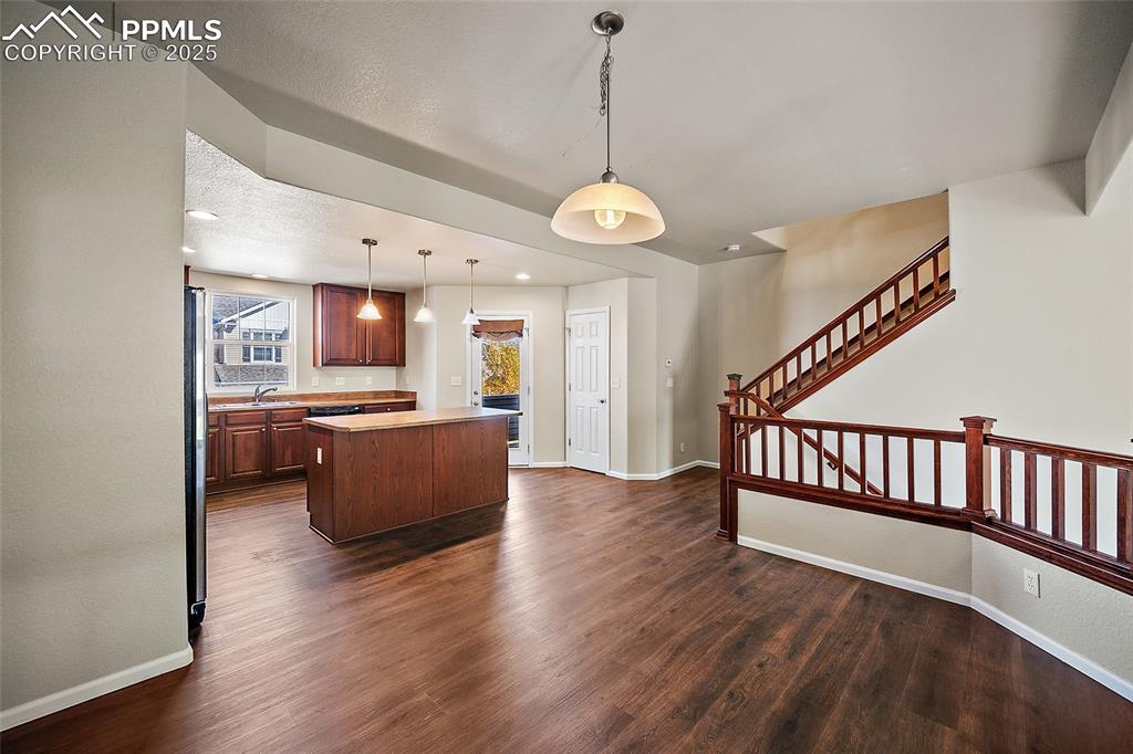 Image 16 of 50: Dining area and kitchen adjoin.