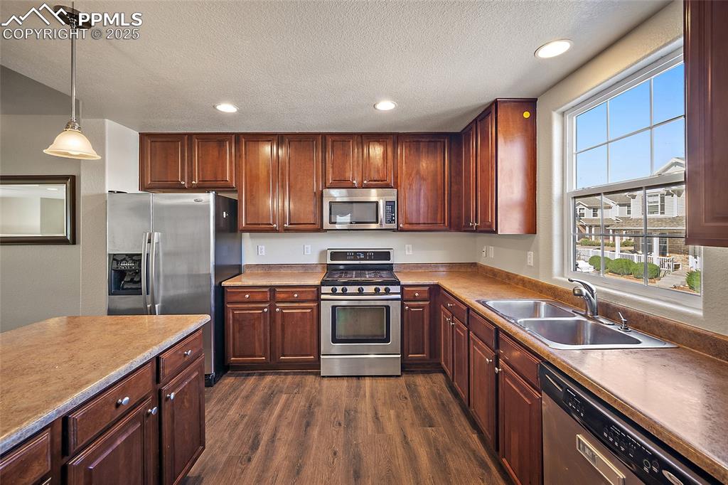 Image 19 of 50: All new Luxury Vinyl flooring and large window for morning sunshine! 