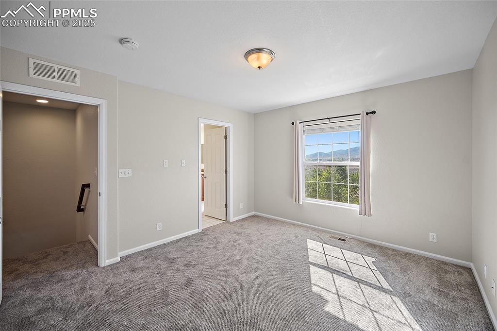 Image 26 of 50: Large Primary bedroom with attached 5-piece bath.  