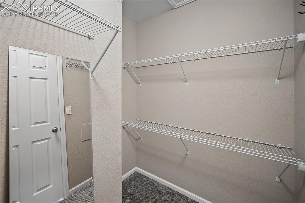 Image 33 of 50: Large Primary closet. 