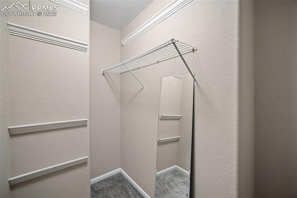 Image 34 of 50: Primary closet. 