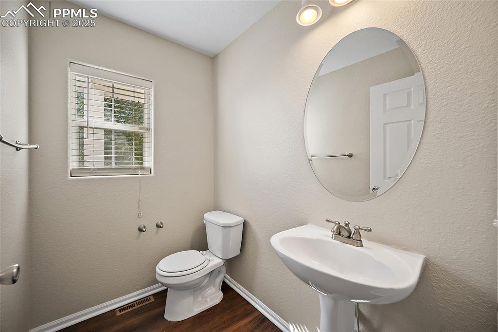 Image 9 of 50: Powder room off of the Great room.  