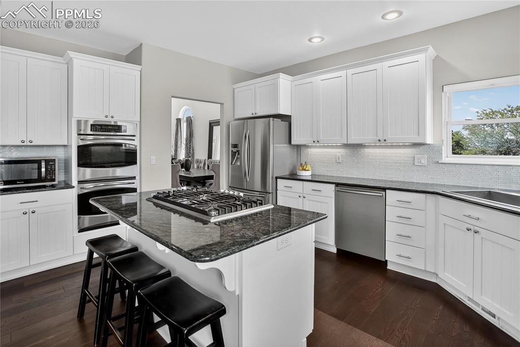 Image 6 of 30: Granite counters & SS appliances including dual oven