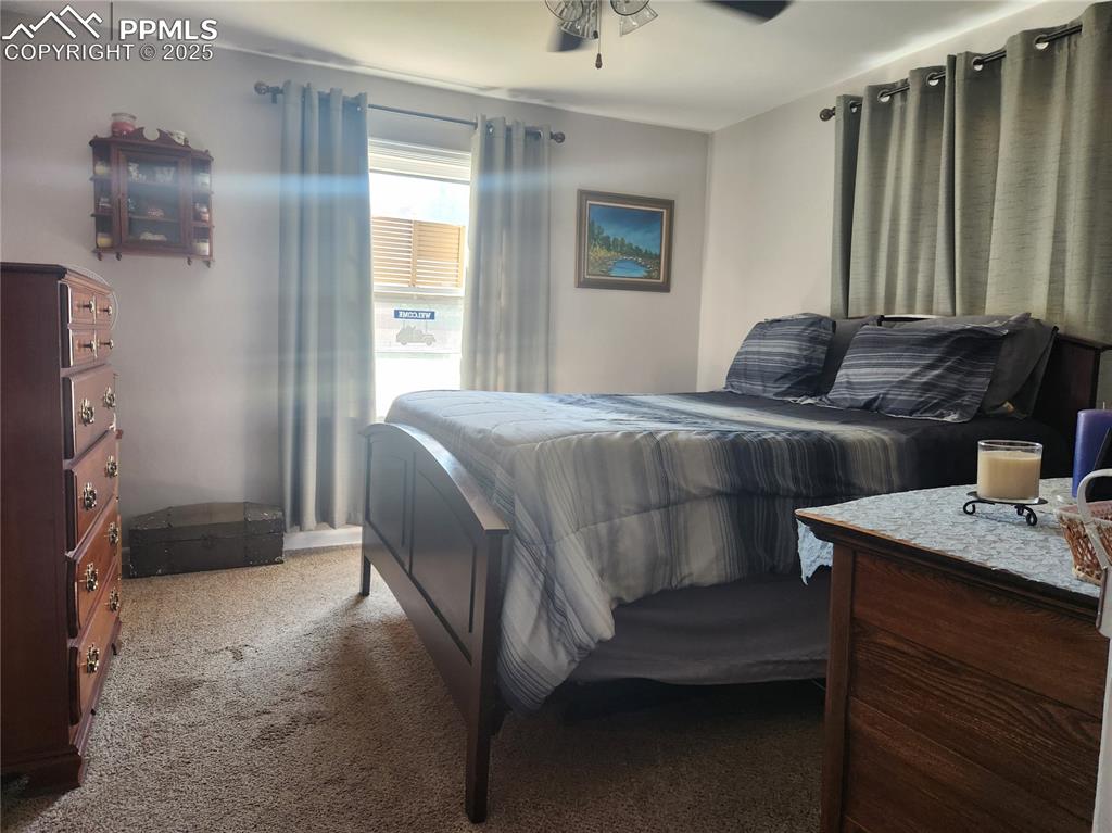 Image 6 of 10: Bedroom featuring carpet and a ceiling fan