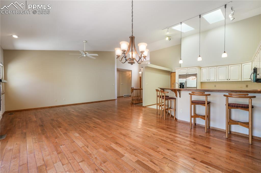 Image 15 of 50: Dining area with hardwood floors