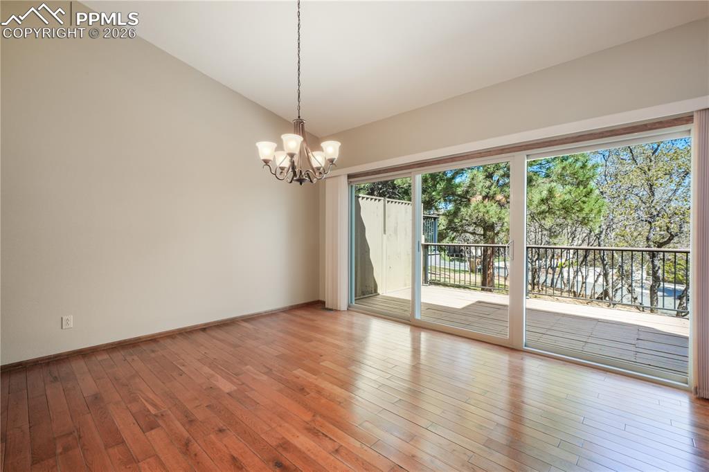Image 16 of 50: Dining area with hardwood floors