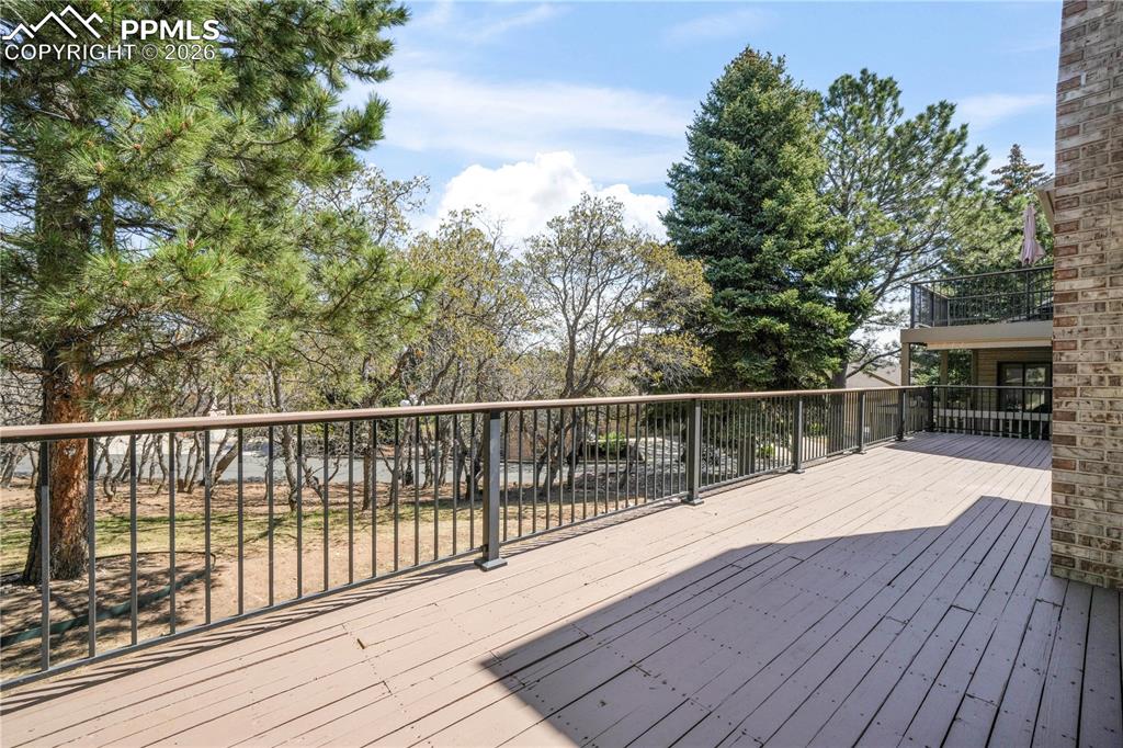 Image 18 of 50: Private deck with extended patio doors