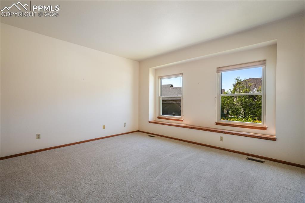 Image 27 of 50: Main floor 2nd bedroom with new carpet