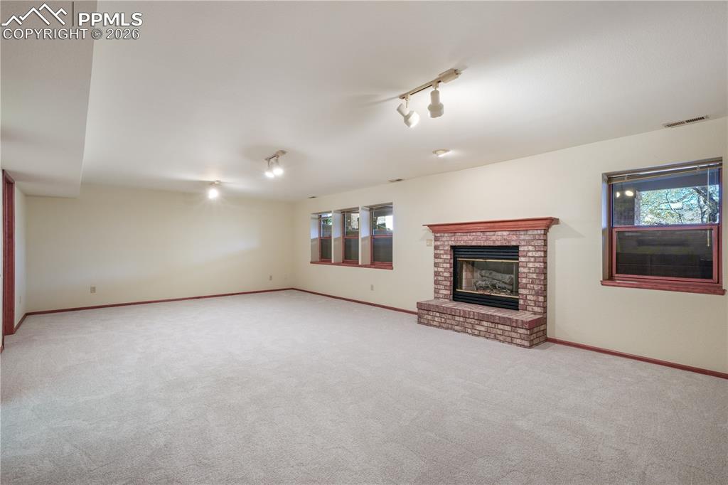 Image 34 of 50: Basement family room, new carpet