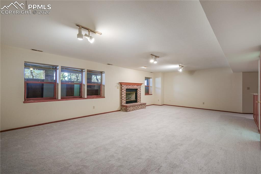 Image 35 of 50: Basement family room, new carpet