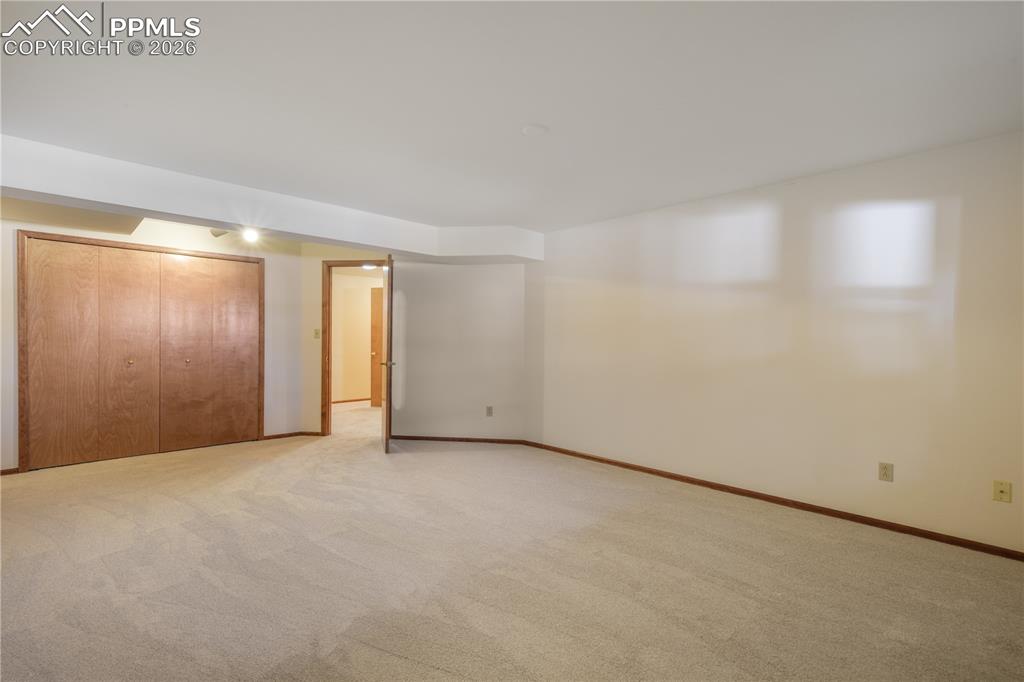 Image 39 of 50: Basement 3rd bedroom with new carpet