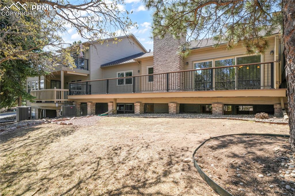 Image 43 of 50: Back deck and yard