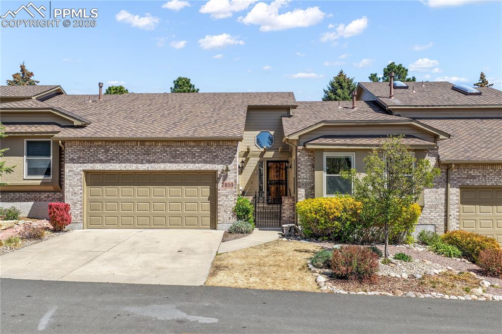 Image 46 of 50: Front of home with 2 car garage