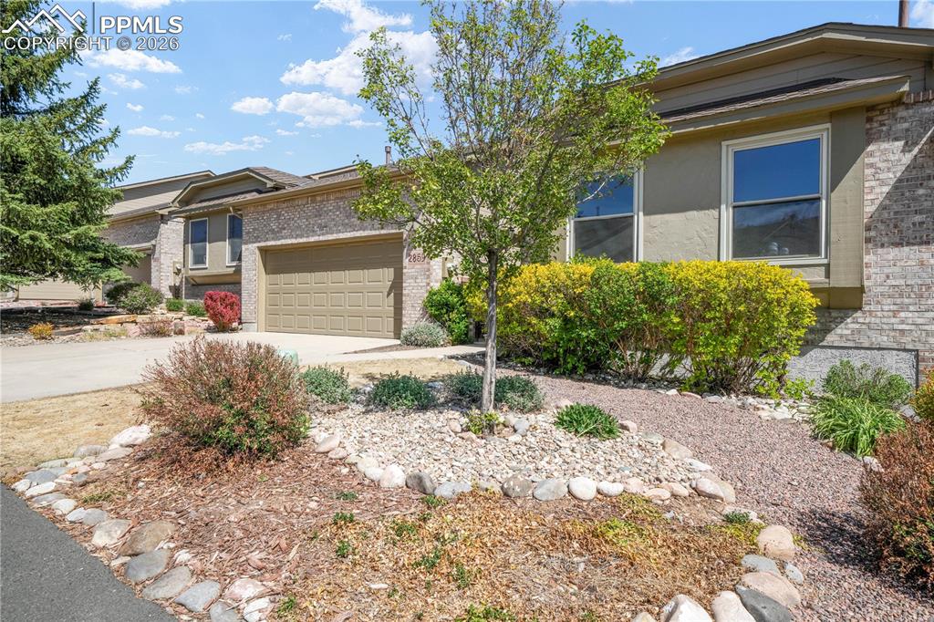 Image 47 of 50: Front of home with 2 car garage