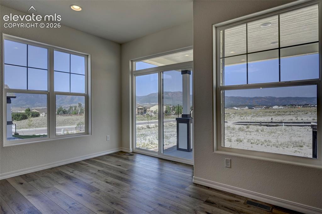 Image 14 of 35: nook with a slider ot the back patio and mountain views!