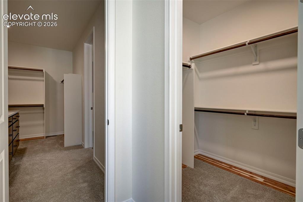 Image 23 of 35: showing closet 1 and 2 in primary (walk-in and wardrobe)