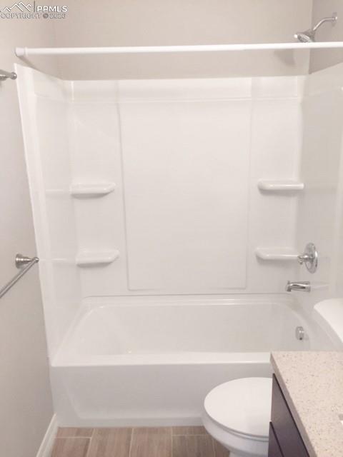 Image 13 of 19: Full bath with vanity and tub / shower combination