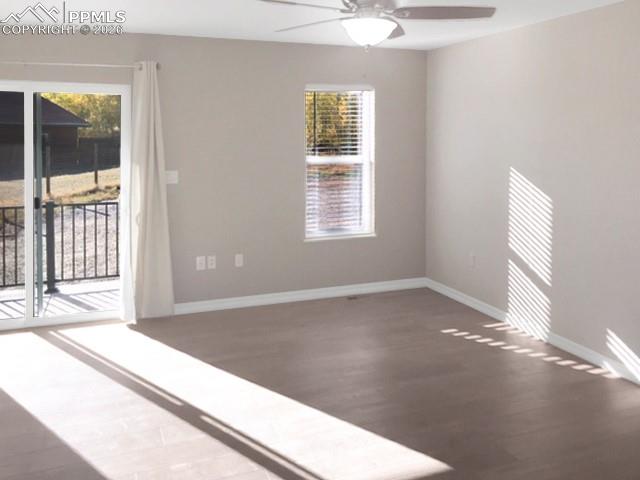 Image 7 of 19: Living room with plenty of natural light, vinyl plank flooring, and a ceili