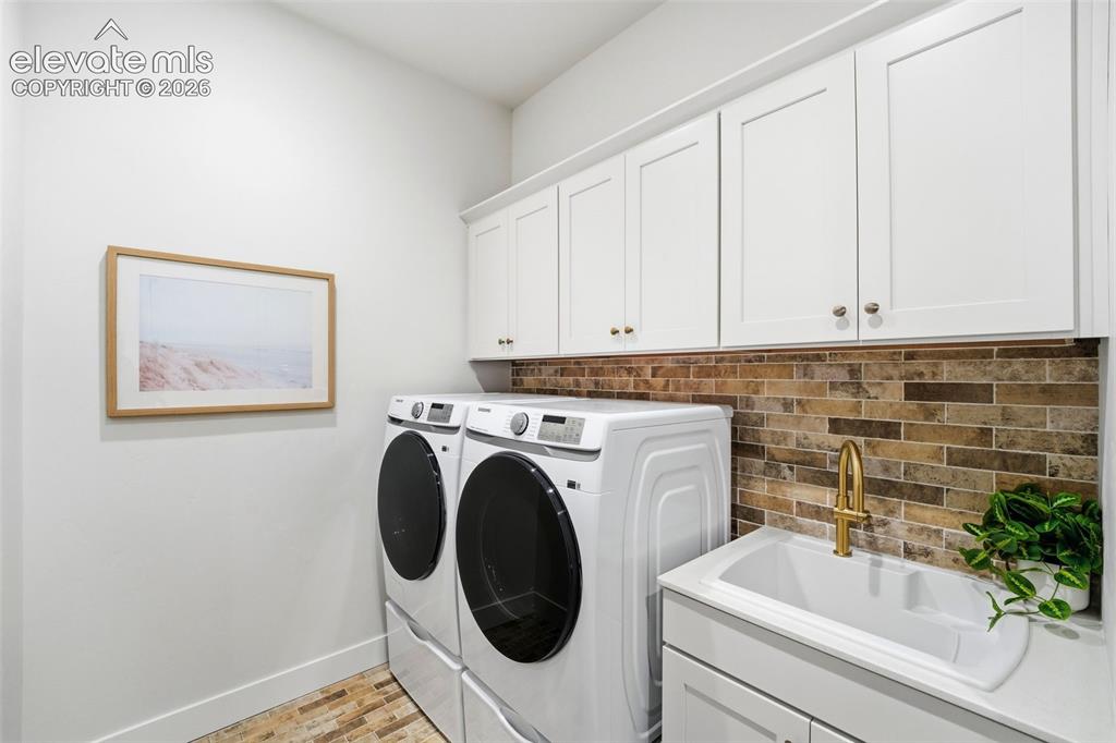 Image 21 of 50: Laundry Room with access off the Primary Closet