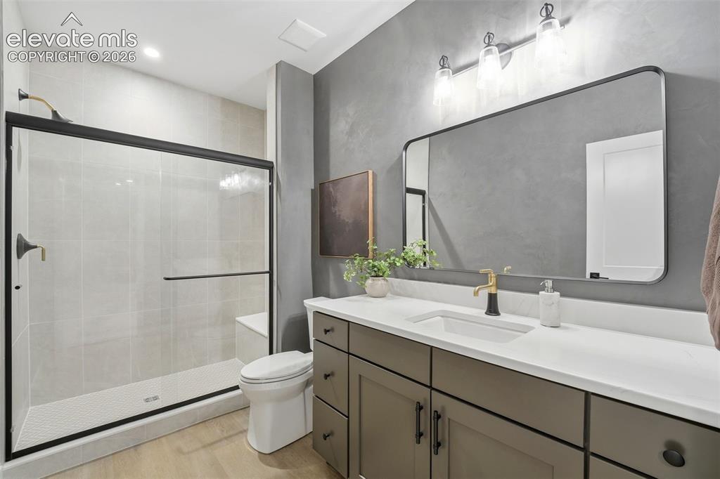 Image 36 of 50: 3/4 Bath located in the Lower Level next to Bedrooms 3 and 4